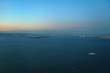 Aerial view of the Tokyo Bay, Japan, at nightfall in approach at Haneda Airport