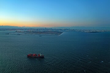 Aerial view of the Tokyo Bay, Japan, at nightfall in approach at Haneda Airport