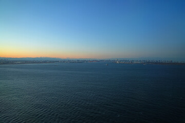 Aerial view of the Tokyo Bay, Japan, at nightfall in approach at Haneda Airport
