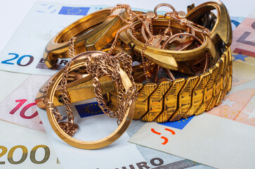 A scrap of gold. Old and broken jewelry, watches of gold and gold-plated gold plated wristwatch...