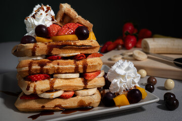 waffle tower with fruit, cream and chocolate balls