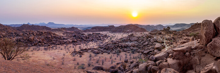 Scenic panorama of rocky mountains at sunset, Damaraland landscape, Namibia web banner, Africa