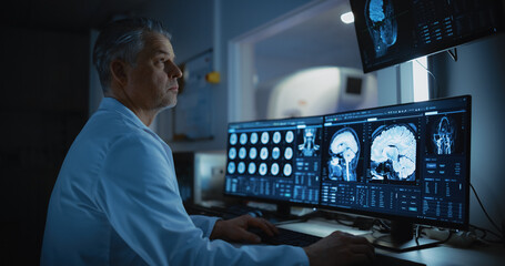 In Medical Laboratory Patient Undergoes MRI or CT Scan Process, in Control Room Doctor Watches...