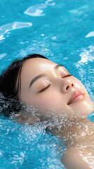 A woman enjoys a serene moment as she floats effortlessly in a crystal-clear swimming pool, soaking up the warm sun on a beautiful afternoon