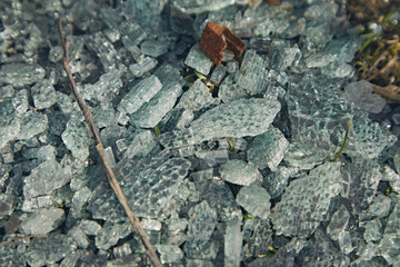 Pieces of broken burnt car glass close-up