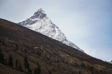 Majestic mountain peak surrounded by nature high altitude landscape photography serene environment wide angle view adventure spirit