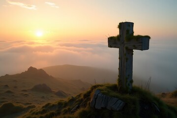 A rustic wooden cross covered in moss, standing alone on a foggy hilltop at sunrise.