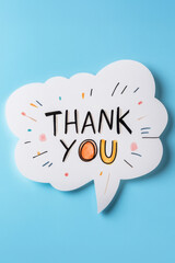 White paper speech bubble with message Thank You on light blue background