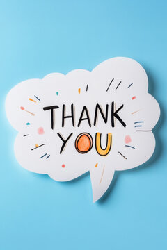 White paper speech bubble with message Thank You on light blue background