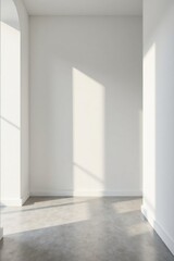 Empty room with arched window and sunlight illuminating the floor and walls