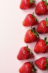 A Vibrant Arrangement of Fresh, Ripe Strawberries on a Soft Pink Background