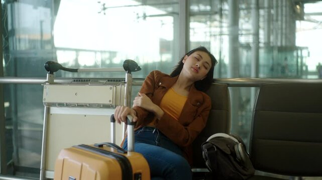 Unhappy young woman traveler disappointed with flight delay or cancelation while waiting at airport terminal, female tourist upset after receiving bad news when resting at airline lounge.
