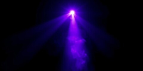A mesmerizing purple projector light beam creating cinematic effects with smoke texture on a black background,  isolated,  movie