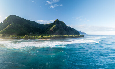 Aerial view of Maniniholo Bay and Ke'e beach towards the Na Pali coastline of Kauai