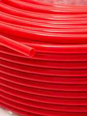 Red irrigation hose close-up. Background.