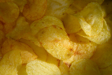 Crunchy golden potato chips filling a bowl perfect for sharing during movie night