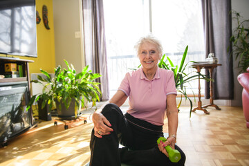 Portrait of nice senior training at home