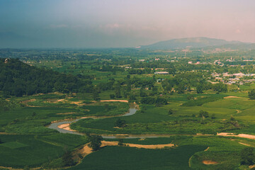 Oxbow lake with green field, Chiang Rai, Thailand.