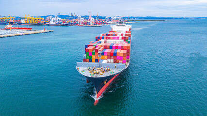 A large number of container ships are sailing at sea.
