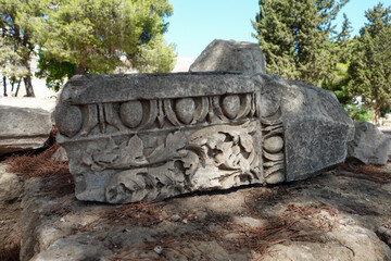 Ancient Carved Stone Fragment in Ruins