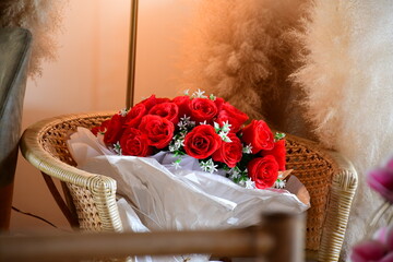 red rose and wedding rings
