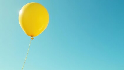 Obraz premium Yellow balloon tied to a pole with a long string unwinding from it, string, pole