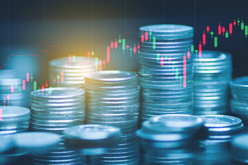 Double exposure of money coin, stock market or forex trading graph and candlestick chart suitable for financial investment concept. 