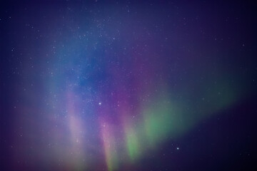 Obraz premium Aurora borealis, polar lights with Milky Way stars.