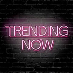 Obraz premium Bright Pink Neon Sign Reading “Trending Now”
