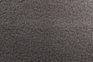 Texture of dense grey fabric for tailoring. Canvas. Textile. Material. Wool