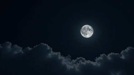 Serene Night Sky Full Moon Rising Above a Bank of Dark Clouds