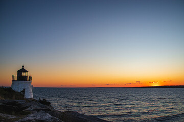 Coastal Lighthouse Overlooking the Ocean at Sunset