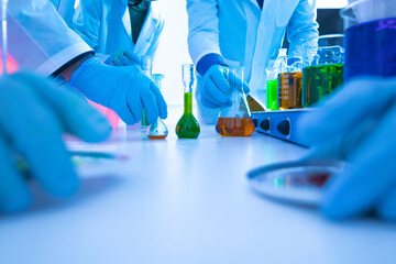 Scientists conducting chemical experiments in laboratory