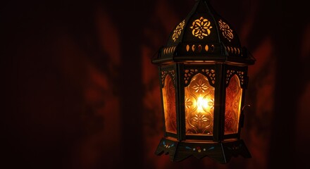 Ornate lantern casting warm light and intricate shadows on a wall