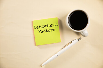 Behavioral factors text on paper