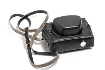 Black camera case with strap on white background. Closeup.