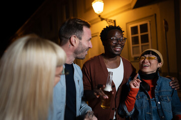 Group of Multi-Ethnicity people having fun outdoor in the night. Celebrate.