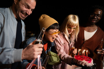 Group of Multi-Ethnicity people having fun outdoor in the night. Celebrate.