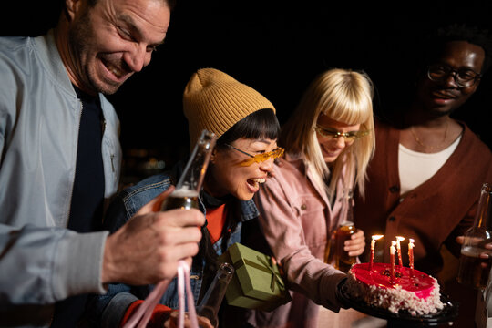 Group of Multi-Ethnicity people having fun outdoor in the night. Celebrate.