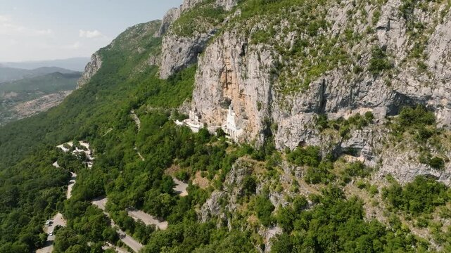 Drone view of Ostrog Monastery in the cliff high on the mountain in Montenegro