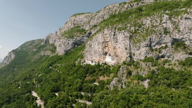 Drone view of Ostrog Monastery in the cliff high on the mountain in Montenegro