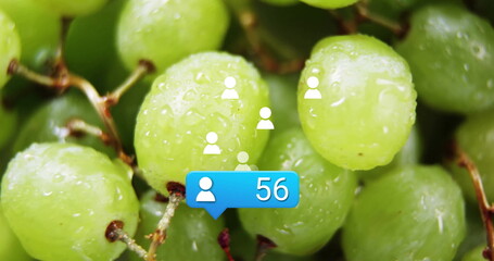 Social media notification image over close-up of green grapes