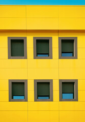 Residential building. Colorful windows on a building.