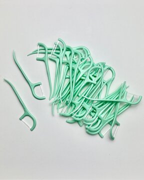 A mint toothpick is a small, slender pick with a light green color.