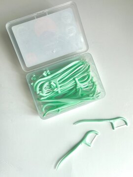 A mint toothpick is a small, slender pick with a light green color.