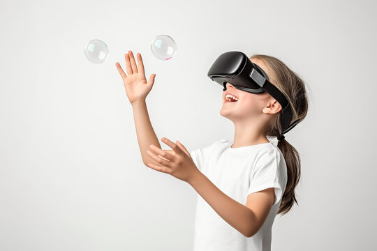 A child wearing VR glasses, reaching out excitedly to touch floating virtual bubbles, on plain background