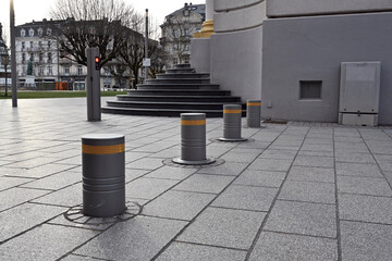 Automatic security bollards used as vehicle barrier. The barrier elements protect pedestrians from terrorist attacks done by vehicles and are part of security plan. 