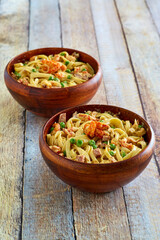 cajun style seafood alfredo pasta served in bowls