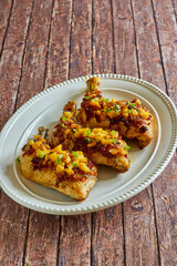 chicken leg quarters toped with peach chutney