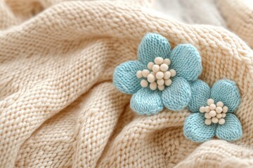 Delicate Knitted Flowers on Creamy Wool Fabric a Cozy and Artistic Composition Capturing the Texture and Warmth in Soft Light